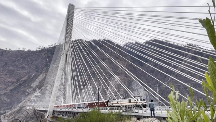 Trial Train passes through the India’s first cable stayed railway bridge on Katra-Reasi rail line. -Excelsior/Romesh Mengi Trial Train passes through the India’s first cable stayed railway bridge on Katra-Reasi rail line. -Excelsior/Romesh Mengi