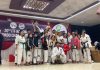 Taekwondo players of Jammu and Kashmir posing along with 1st runner-up trophy.