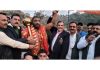 Dignitaries posing along with winning wrestler at Reasi on Friday.