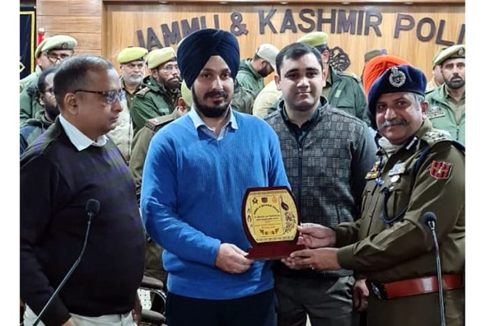 IGP Crime Sunil Gupta and DIG JSK Range Shiv Kumar Sharma presenting a memento to instructors at DPL Jammu on Sunday.