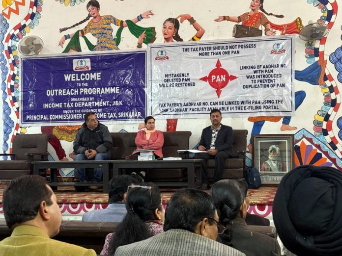 Income Tax Deptt officers replying to queries of participants during awareness programme at SRML Hr Sec School Jammu.