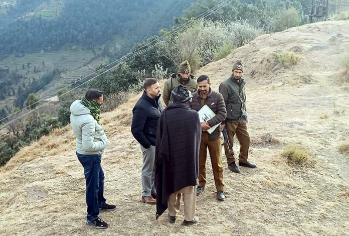 SIT members on the job in Badhaal village of Rajouri. — Excelsior/Imran SIT members on the job in Badhaal village of Rajouri. — Excelsior/Imran