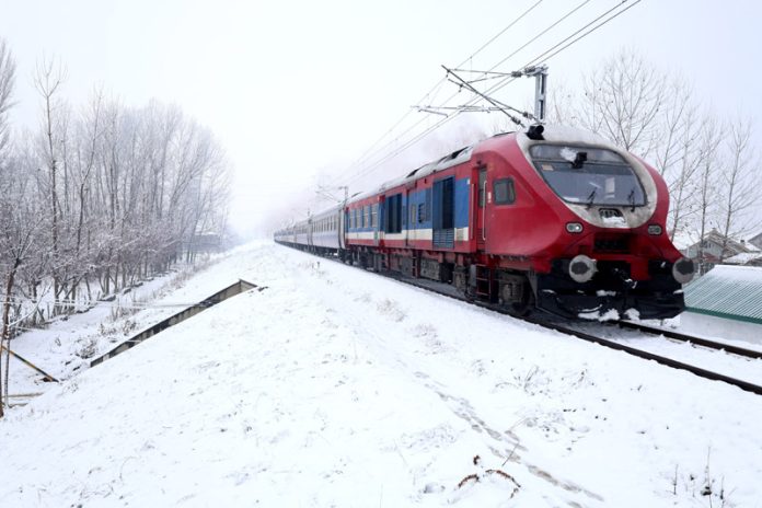 Train moves steadily along the track with snow-dusted surroundings in Srinagar on Monday morning. —Excelsior/Shakeel Train moves steadily along the track with snow-dusted surroundings in Srinagar on Monday morning. —Excelsior/Shakeel