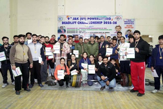 Dignitaries posing with Powerlifters during closing ceremony of the 9th J&K (UT) Deadlift Powerlifting Championship at Indoor Stadium, Bhagwati Nagar, Jammu.