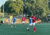Football players in action during a match between J&K Bank XI and City Club Udhampur at Mini Sports Stadium Parade.