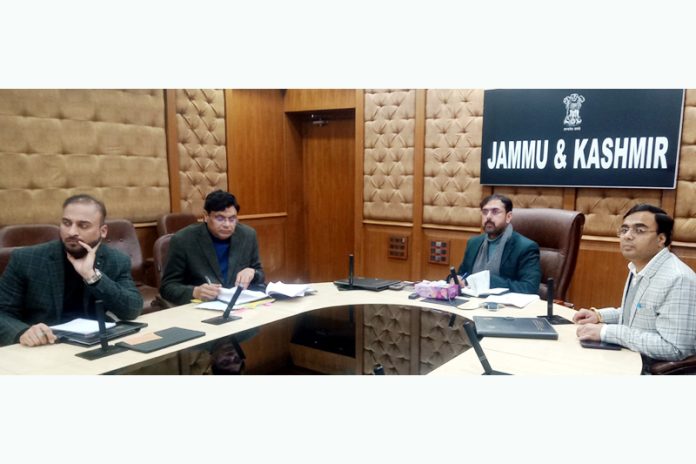 Minister Satish Sharma chairing a meeting on Friday.