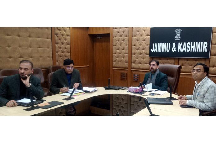 Minister Satish Sharma chairing a meeting on Friday.