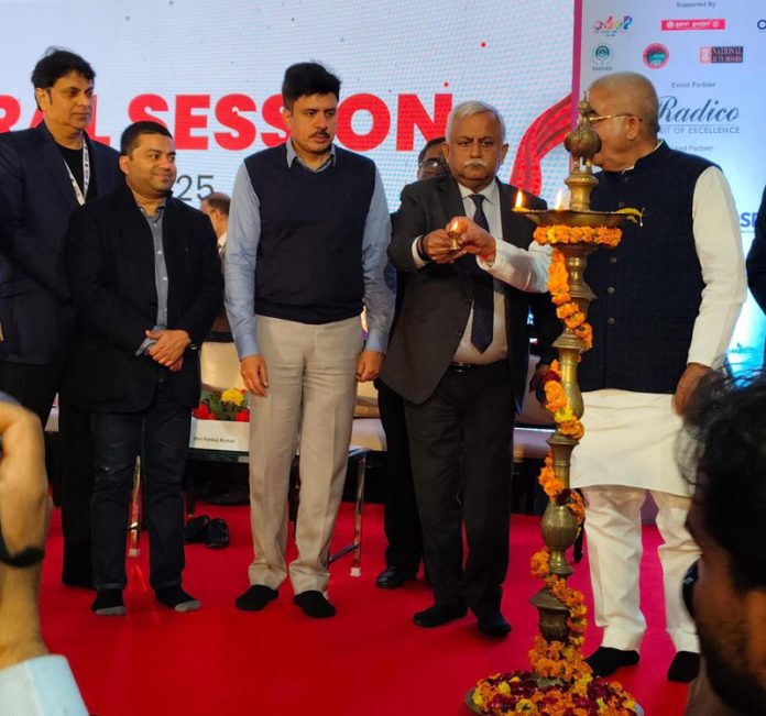 Sudeep Goenka, Director of Goldy Group and others lighting the traditional lamp during a function on Friday.