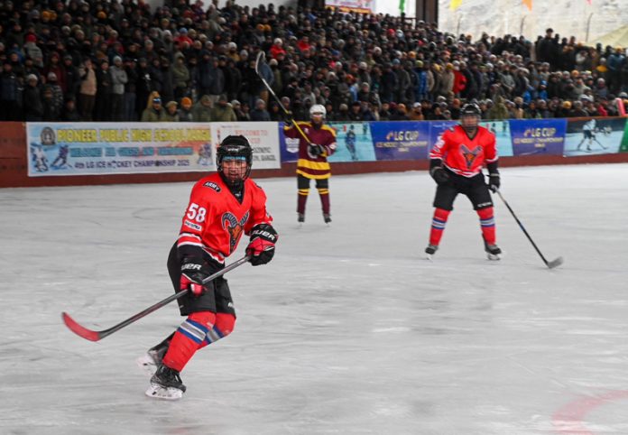Ice hockey players in action during a match at Kargil on Thursday. - Excelsior/Basharat Ladakhi