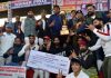 Chief Guest ADGP Jammu Zone Anand Jain presenting trophy to the winning team at Kathua during 13th Police Martyr's Memorial North Zone T-20 Cricket Championship.