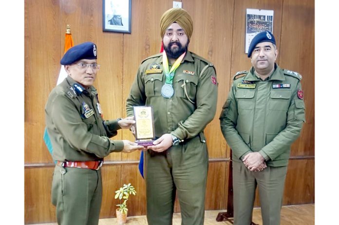 ADGP Jammu Zone Anand Jain felicitating SPO Manpreet for winning the silver medal at the national level event. ADGP Jammu Zone Anand Jain felicitating SPO Manpreet for winning the silver medal at the national level event.