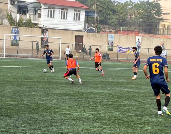Players in action during a football match at Mini Stadium Parade, Jammu on Thursday. Players in action during a football match at Mini Stadium Parade, Jammu on Thursday.