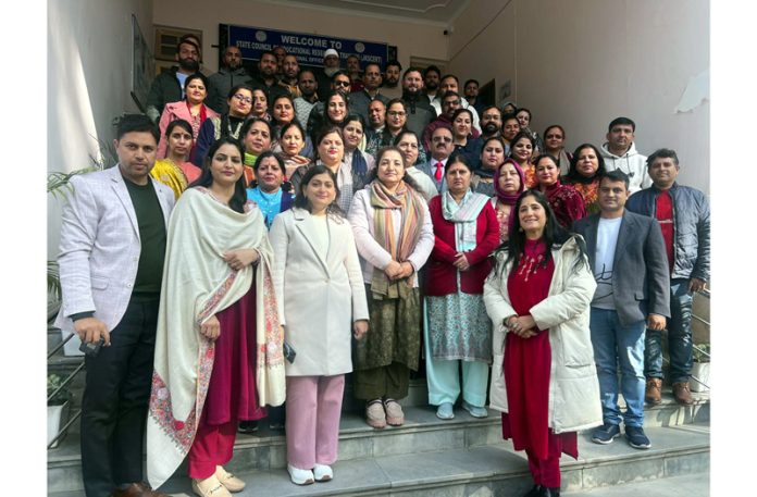 Dignitaries alongwith students posing for a group photograph after orientation programme.