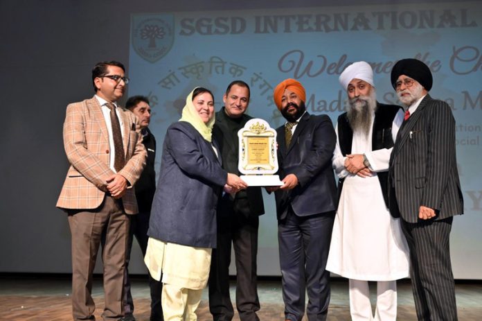 Minister Sakina Itoo receiving memento during a programme at SGSD International School.