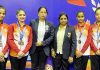 Junior J&K Gymnastics team posing along with coaching staff at Surat.