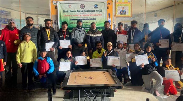 Winners display their certificates after conclusion of District Shopian Carrom Championship.
