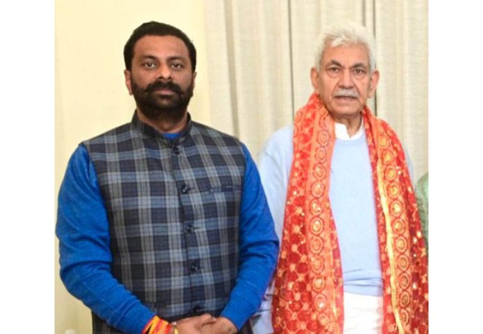 Keshav Chopra posing with Manoj Sinha.