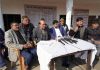 Former president of AJKSGKS Joginder Lal Bhagat along with others during a press conference at Jammu.