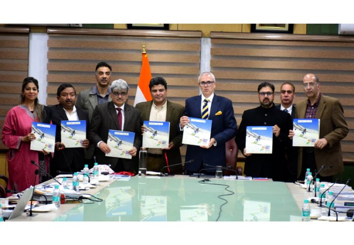 Chief Minister Omar Abdullah and others releasing souvenir during high-level review meeting at Gulmarg.