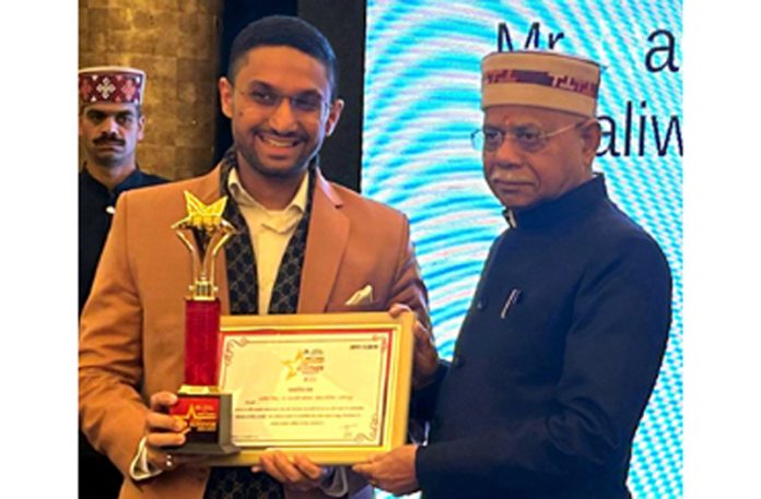 Shiv Pratap Shukla, Governor of Himachal Pradesh presenting an award to Arsh Dhaliwal on Monday.