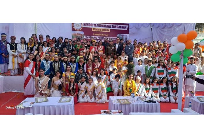 Dignitaries posing along with students during a programme at KVS Regional Office Jammu.