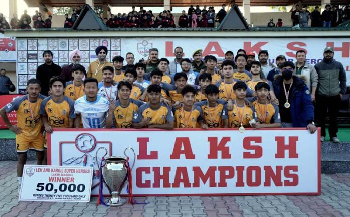 Winning team Realona FC Kargil, posing with the trophy alongside dignitaries during the prize distribution ceremony at Mini Stadium, Parade, Jammu on Wednesday. Winning team Realona FC Kargil, posing with the trophy alongside dignitaries during the prize distribution ceremony at Mini Stadium, Parade, Jammu on Wednesday.