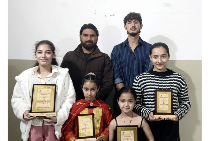 J&K Athletes posing along with management.