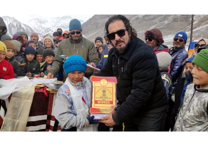 Dignitary presenting trophy to the captain of the winning team at Kargil.