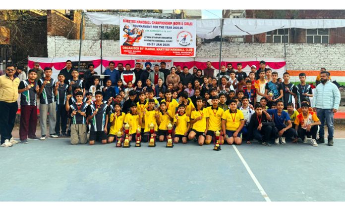 Dignitaries posing along with Handball players at Udhampur on Tuesday.