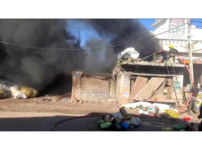 High flames coming out of scrap store at new Bus Stand, Udhampur on Friday. -Excelsior/ K Kumar. High flames coming out of scrap store at new Bus Stand, Udhampur on Friday. -Excelsior/ K Kumar.