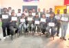 Trainees displaying certificate after completion of Solar Technician course at NITS Polytechnic.