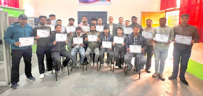 Trainees displaying certificate after completion of Solar Technician course at NITS Polytechnic.