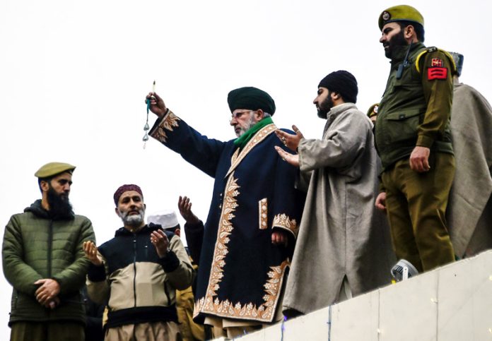 Holy relic being shown to devotees at Hazratbal shrine on Friday. -Excelsior/Shakeel