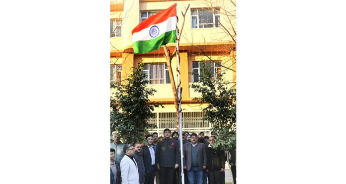 Director Information Jatin Kishore unfurling National Flag.