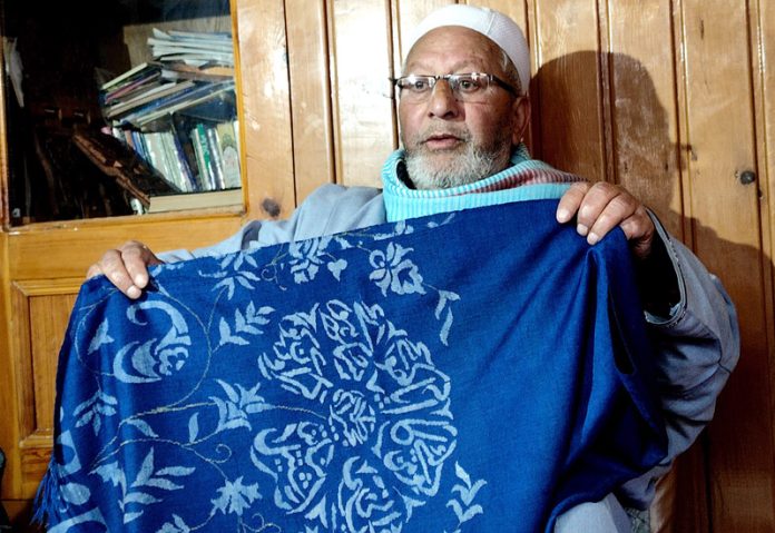 Padma Shri awardee Farooq Ahmad Mir at his residence in Srinagar's Natipora area. —Excelsior/Shakeel