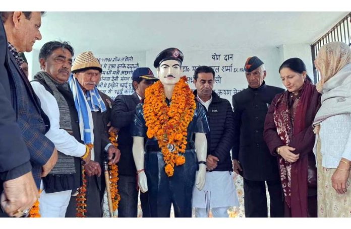 Rajiv Jasrotia along with other prominent people paying tribute to Martyr Rifleman Mangal Singh at Ladoli in Kathua district on Sunday.