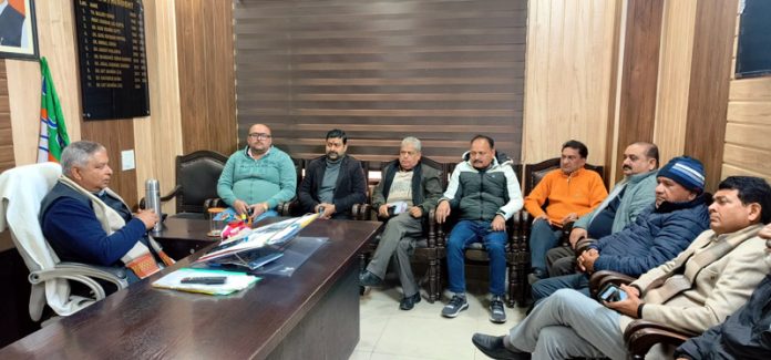 J&K BJP president, Sat Sharma chairing a meeting of party activists at party headquarters in Jammu.