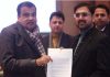 Minister Satish Sharma giving a memorandum to Union Minister Nitin Gadkari.