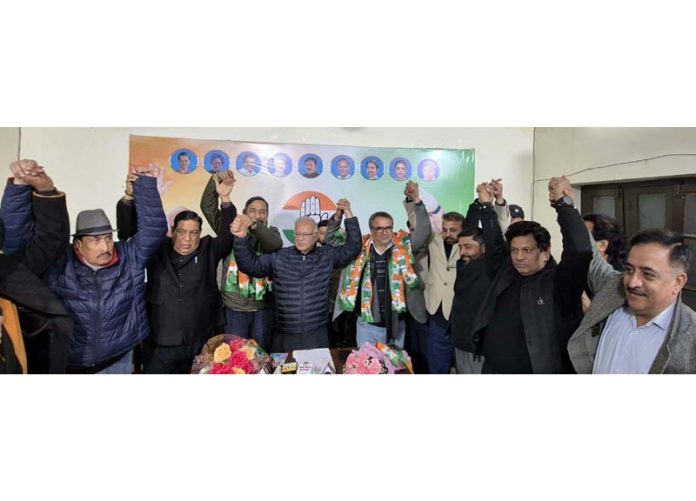 JKPCC president Tariq Hameed Karra with new entrants and other party leaders during a joining function at Jammu.