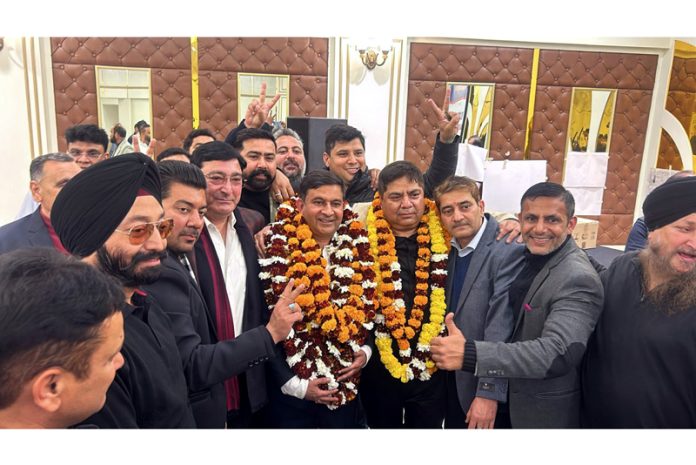 Newly elected office bearers of JKPDA posing with their supporters.