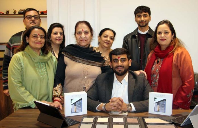 Architect Anchit Sharma posing along with others during opening of his office in Jammu on Friday.