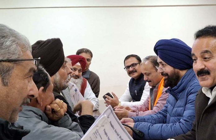 MLA Dr Narinder Singh interacting with the people during a public darbar held in Jammu on Wednesday.