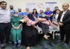 Executives of SMVD Institute of Medical Excellence and Narayana Hospital posing with ENT surgical team on completion of 100 cochlear implant surgeries.