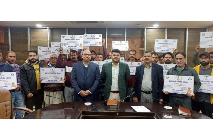 JMC Commissioner Dr Devansh Yadav & others during a function in Jammu on Monday.