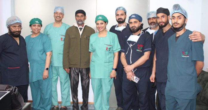 A patient who underwent a surgery for rare laryngeal cancer along with doctors who performed the procedure at Pulse Hospital Jammu. A patient who underwent a surgery for rare laryngeal cancer along with doctors who performed the procedure at Pulse Hospital Jammu.