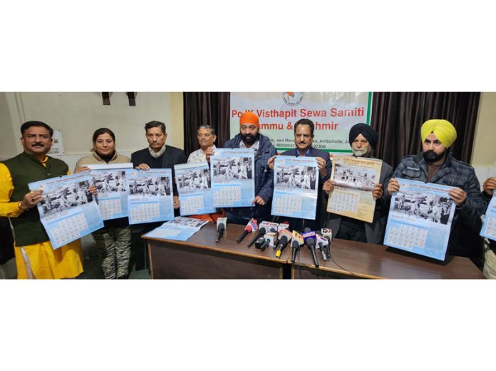 PoJK Visthapit Samiti members releasing annual calendar in Jammu. -Excelsior/Rakesh