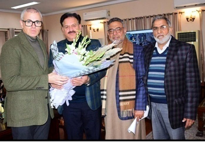 A delegation from Gurjar Desh Charitable Trust presenting a bouquet to Chief Minister Omar Abdullah.