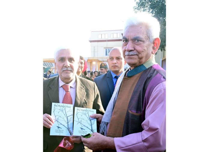 Brij Nath Pandit Betab presenting his book to LG Manoj Sinha on Tuesday.