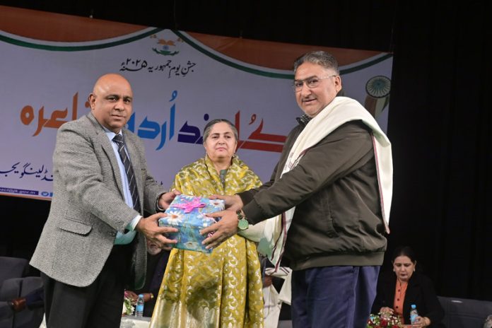 Principal Secretary Culture, SK Gupta presenting a gift to Urdu poet Dr Liaqat Jafri at Abhinav Theatre in Jammu on Tuesday.