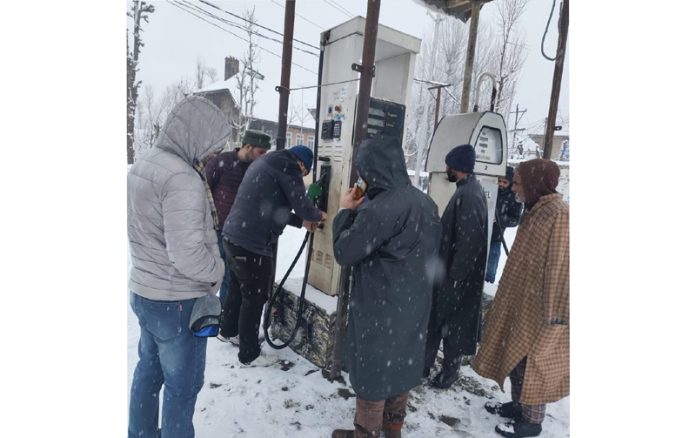 LMD officials inspecting a fuel dispensing unit. LMD officials inspecting a fuel dispensing unit.